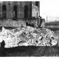 Image showing workers standing on demolished stack, old sailing ship to the right